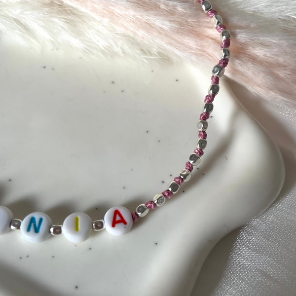 CL0167 Collana baby argento con pepite mini e nodi in filo nautico colorato con iniziali