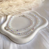 CL0187 Collana con rondelle di cristalli iridescenti