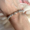 B127 Bracelet with knots and pink heart passing through the center