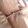 B054 Bracciale con palline martellate e rondelle con stelle bombate
