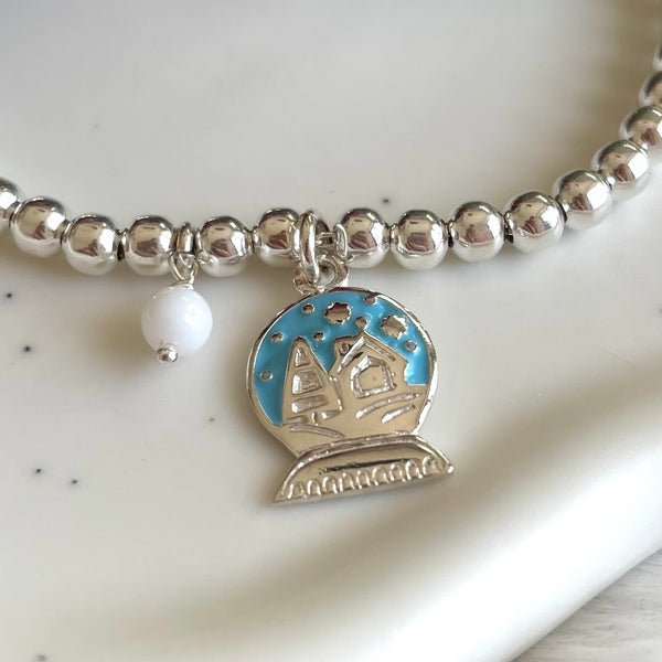 B0226 Bracciale palline con ciondolo palla di neve