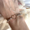 B125 Bracciale con pepite martellate medie e nodini rosati+ cuore vuoto grande centrale