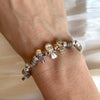 B146 Bracciale con elementi passanti bimbi cordino cerato con granelli nuovi