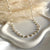 CL051 Rosary necklace with natural pearls and intertwined heart