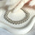 B066 Bracciale intreccio con palline rigate