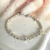 B054 Bracciale con palline martellate e rondelle con stelle bombate