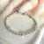 B054 Bracciale con palline martellate e rondelle con stelle bombate