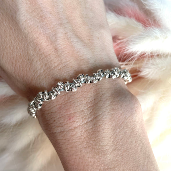 B072 Bracciale intreccio con palline martellate e nodi intreccio
