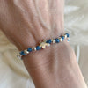 B0276 Bracciale con nodi, palline martellate e puzzle passante