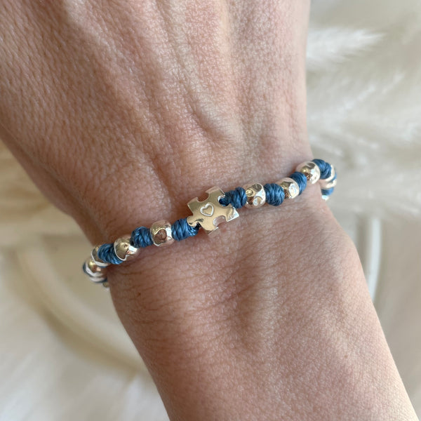 B0276 Bracciale con nodi, palline martellate e puzzle passante