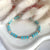 B090 Bracciale cilindri e rondelle in argento + rondelle turchesi