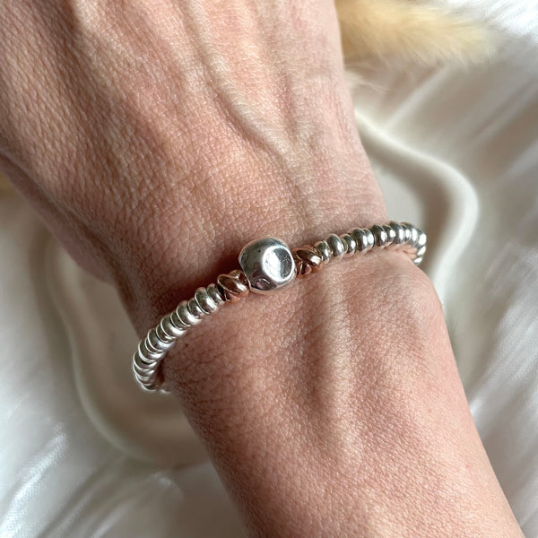 B0183 Bracciale con rondelle e pepitone al centro