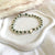 B0297 Bracciale con nodi, pepite e puzzle passante