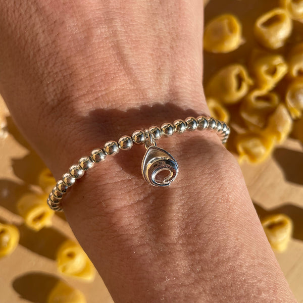 B130 Bracciale con palline e ciondolo Tortellino pendente