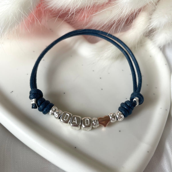 B143 Bracciale DAD cordino cerato e granelli nuovi + cuore rosato passante