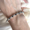 B084 Bracciale con rondelle ematite intervallate a rondelle piccole e medie