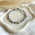B0297 Bracciale con nodi, pepite e puzzle passante