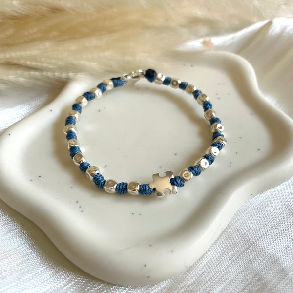 B0297 Bracciale con nodi, pepite e puzzle passante