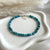 B0287 Bracciale con cubetti in apatite sfaccettata e rondelle argento