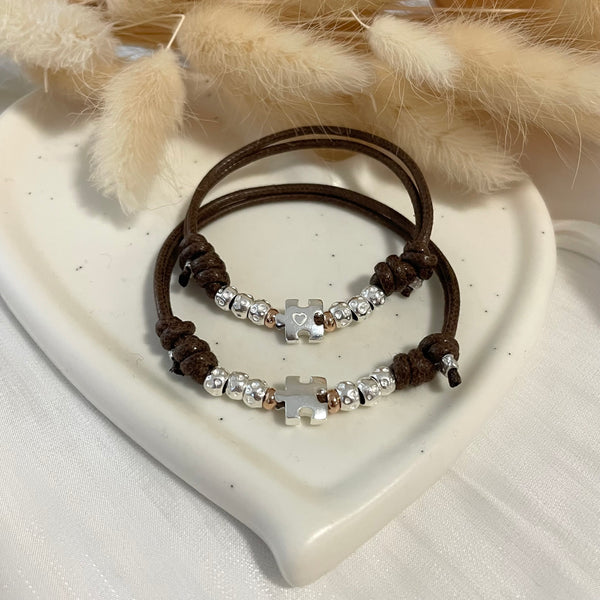 B0241 Bracciale in cordino cerato di coppia con puzzle e granelli