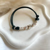 B0242 Bracciale in cordino cerato di coppia con puzzle, iniziali cubo e rondelle