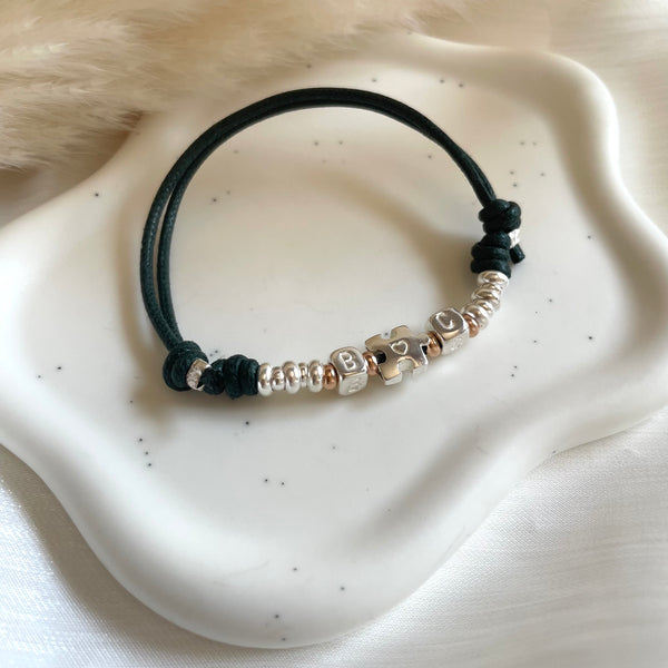 B0242 Bracciale in cordino cerato di coppia con puzzle, iniziali cubo e rondelle