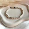 B0302 Bracciale con rondelle irregolari martellate piccole lisce