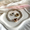 B118 Bracelet with bomby heart in the center and silver knots