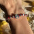 B107 Bracciale con nodi (colore a scelta) pepite e Tortellino passante