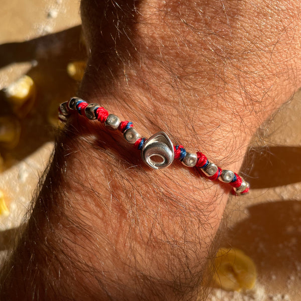 B107 Bracciale con nodi (colore a scelta) pepite e Tortellino passante