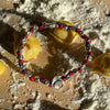 B107 Bracciale con nodi (colore a scelta) pepite e Tortellino passante