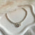 B0279 Bracciale con rondelline piccole, perla e fiore pendente “grazie maestra”