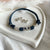 B0246 Bracciale in cordino cerato con simbolo infinto e rondelle