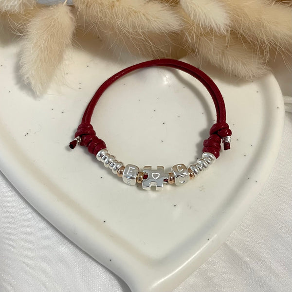 B0242 Bracciale in cordino cerato di coppia con puzzle, iniziali cubo e rondelle