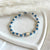B0276 Bracciale con nodi, palline martellate e puzzle passante