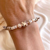 B0299 Bracciale in cordino cerato di coppia con puzzle, iniziali cubo e granelli