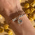 B114 Bracciale rigido con Tortellino pendente