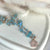 CL056 Rosary necklace with pendant house with zircons