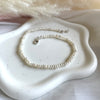CV010 Cavigliera con perle di fiume intervallate da rondelle fiore