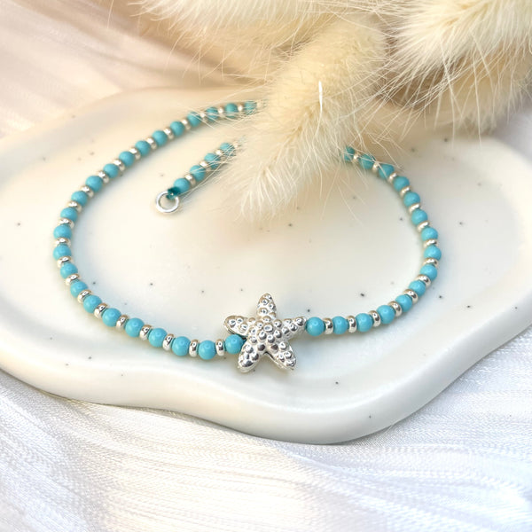 CV007 Cavigliera con palline in pasta di turchese, argento e stella marina passante