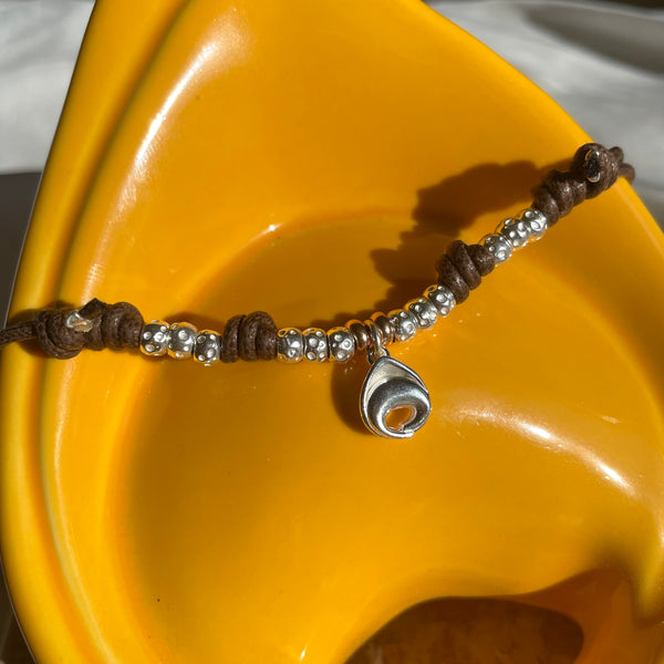 CL031 Necklace with waxed cord and tortellino pendant