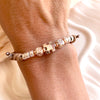 B0299 Bracciale in cordino cerato di coppia con puzzle, iniziali cubo e granelli