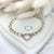 B135 Bracciale con pepite martellate piccole e nodini rosati+ cuore vuoto piccolo centrale