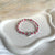 B0306 Bracciale baby con nodi, pepite piccole e puzzle passante