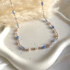 CL053 Rosary necklace with blue colored hydrothermal heart