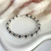 B084 Bracciale con rondelle ematite intervallate a rondelle piccole e medie