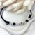 CL048 Necklace with waxed cord and central nugget and pink or gold washers
