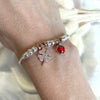 B158 Bracciale con granelli centrali e ciondoli a scelta (non inclusi nel prezzo)