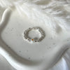 A023 Anello elasticizzato pepite mini e margherita