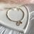 B0268 Bracciale con pepite mini, ciondoli cerchio sagoma cuore e cuore rosato bombato